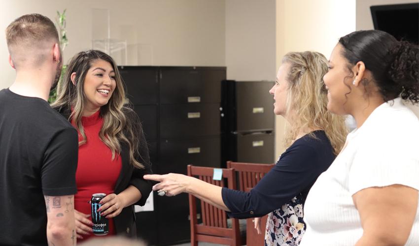 Melissa speaking with ACC employees.